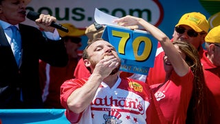 Joey Chestnut Wolfs Down Record 70 Hot Dogs to Reclaim Nathan’s Famous Championship