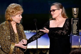 Carrie Fisher, Debbie Reynolds Funeral Features Dancing, Droids and a Standing Ovation