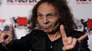 Ronnie James Dio’s Widow Blasts Gene Simmons’ ‘Disgusting’ Trademark Bid for ‘Horns’ Hand Gesture