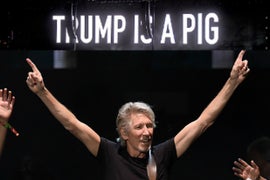 Roger Waters Blasts ‘Buffoon’ POTUS With Neon Anti-Trump Images in Concert (Video)