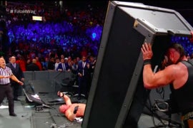WWE ‘SummerSlam’: Watch Braun Strowman Dump an Announce Table on Brock Lesnar (Video)