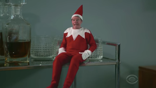 Bryan Cranston Is Santa’s Most Annoying Elf on the Shelf (Video)