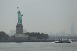 Woman Climbs Statue of Liberty After Protest to Abolish ICE (Video)