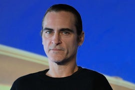 Here’s Your First Look at Joaquin Phoenix as The Joker… Minus Green Hair, Pasty Face and Scary Grin (Photo)