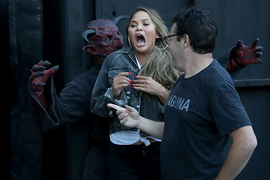 Watch Chrissy Teigen Scream Her Way Through a Haunted House (Video)