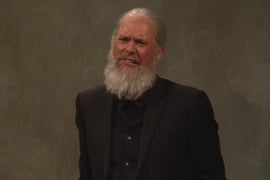 ‘SNL’: Julian Assange, Played by Michael Keaton, Goes to Prison With Lori Loughlin and Michael Avenatti