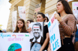 Young women from Paideia High School hold signs during a protest against recently passed abortion ban bills at the Georgia State Capitol building, on May 21, 2019 in Atlanta, Georgia. The Georgia "heartbeat" bill would ban abortion when a fetal heartbeat is detected