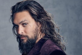 Jason Momoa Says He Can’t Shoot ‘Aquaman 2’ Because He ‘Got Run Over by a Bulldozer’