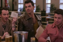 Seth Meyers and Jonas Brothers Get Day Drunk, Write Songs at a Shuffleboard Club (Video)