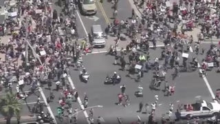 Protesters Crowd Huntington Beach Day After Newsom Orders Closure of All O.C. Beaches (Video)