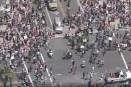 Protesters Crowd Huntington Beach Day After Newsom Orders Closure of All O.C. Beaches (Video)