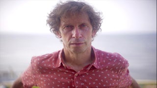 Why ‘Watchmen’ Star Tim Blake Nelson Loved Acting Behind a Mask