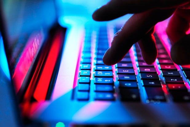 Person typing on laptop