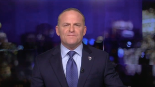 Newsmax’s Grant Stinchfield Blames ‘Liberal’ Fox News Bosses for Tucker Carlson’s Defense of Vladimir Putin