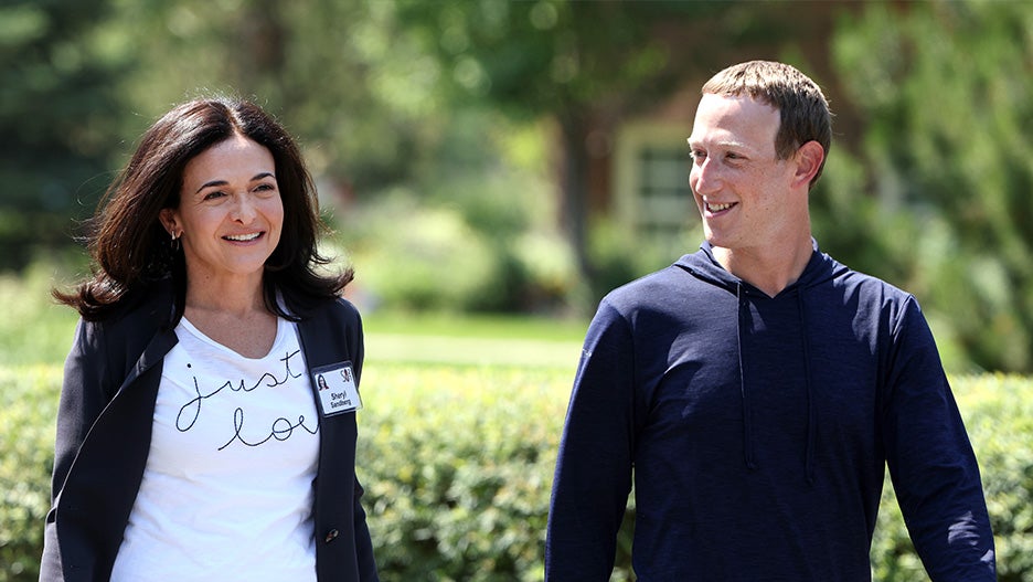 Mark Zuckerberg walks with COO of Facebook Sheryl Sandberg