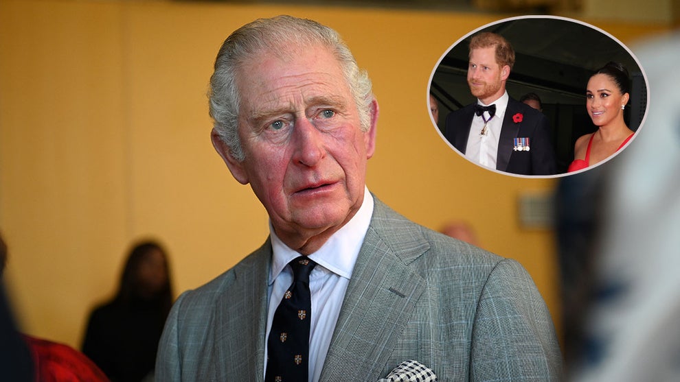 Prince Charles, and Prince Harry and Meghan Markle inset (Getty Images)