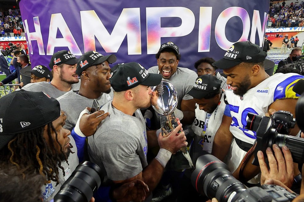 INGLEWOOD, CALIFORNIA - FEBRUARY 13: Los Angeles Rams plays celebrate with the Vince Lombardi Trophy after Super Bowl LVI at SoFi Stadium on February 13, 2022 in Inglewood, California. The Los Angeles Rams defeated the Cincinnati Bengals 23-20. (Photo by Kevin C. Cox/Getty Images)