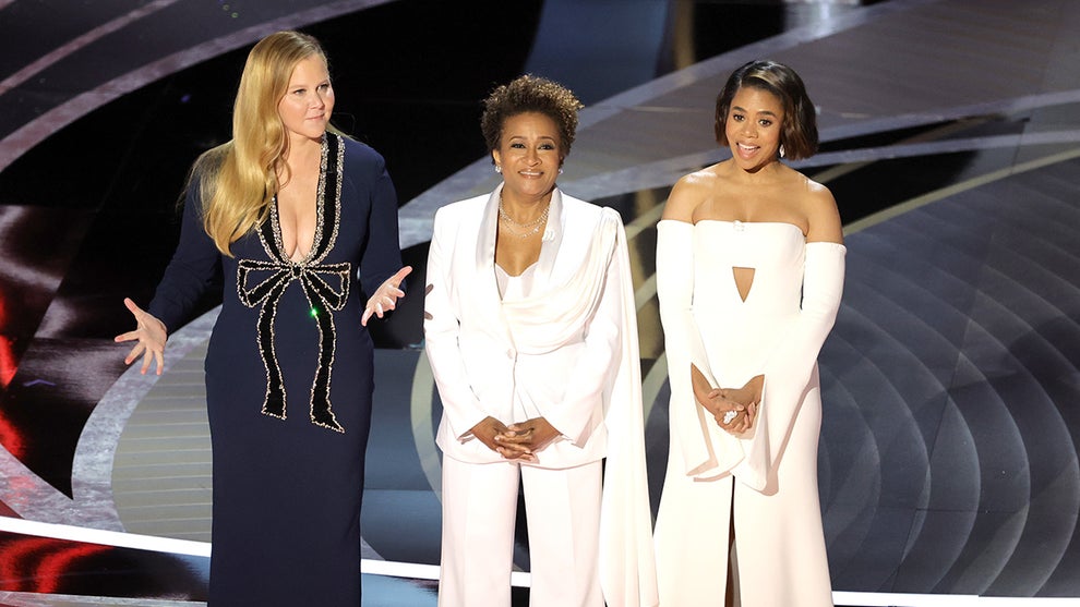 Co-hosts Amy Schumer, Wanda Sykes, and Regina Hall speak onstage during the 94th Annual Academy Awards at Dolby Theatre on March 27, 2022 (Getty Images)