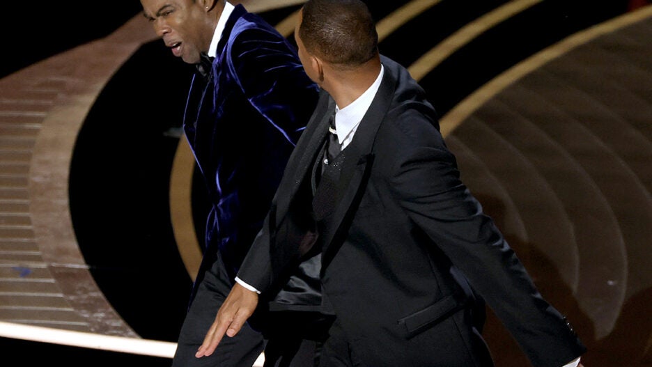 Chris Rock and Will Smith are seen onstage during the 94th Annual Academy Awards at Dolby Theatre on March 27, 2022 (Getty Images)
