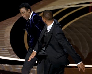 Chris Rock and Will Smith are seen onstage during the 94th Annual Academy Awards at Dolby Theatre on March 27, 2022 (Getty Images)