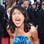 Topless, Screaming Protester Removed From Cannes Red Carpet (Photos)