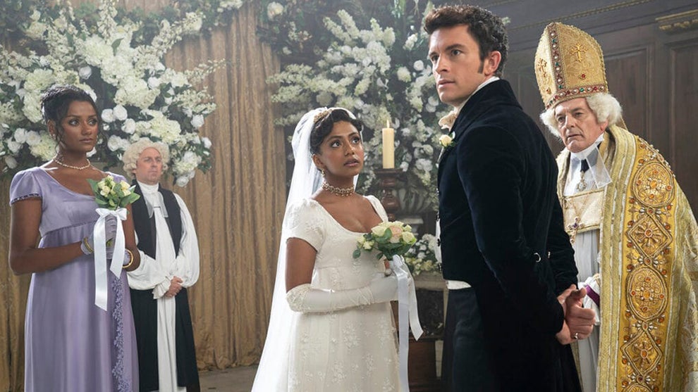 Simone Ashley as Kate Sharma, Charithra Chandran as Edwina Sharma, Jonathan Bailey as Anthony Bridgerton, Anthony Wise as Archbishop in episode 206 of "Bridgerton" (Liam Daniel/Netflix)