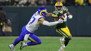 Keisean Nixon #25 of the Green Bay Packers is pursued by Michael Hoecht #97 of the Los Angeles Rams