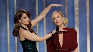 In this handout photo provided by NBCUniversal, L to R Tina Fey and Amy Poehler host the 70th Annual Golden Globe Awards at the Beverly Hilton Hotel International Ballroom on January 13, 2013 in Beverly Hills, California. (Photo by Paul Drinkwater/NBCUniversal via Getty Images)