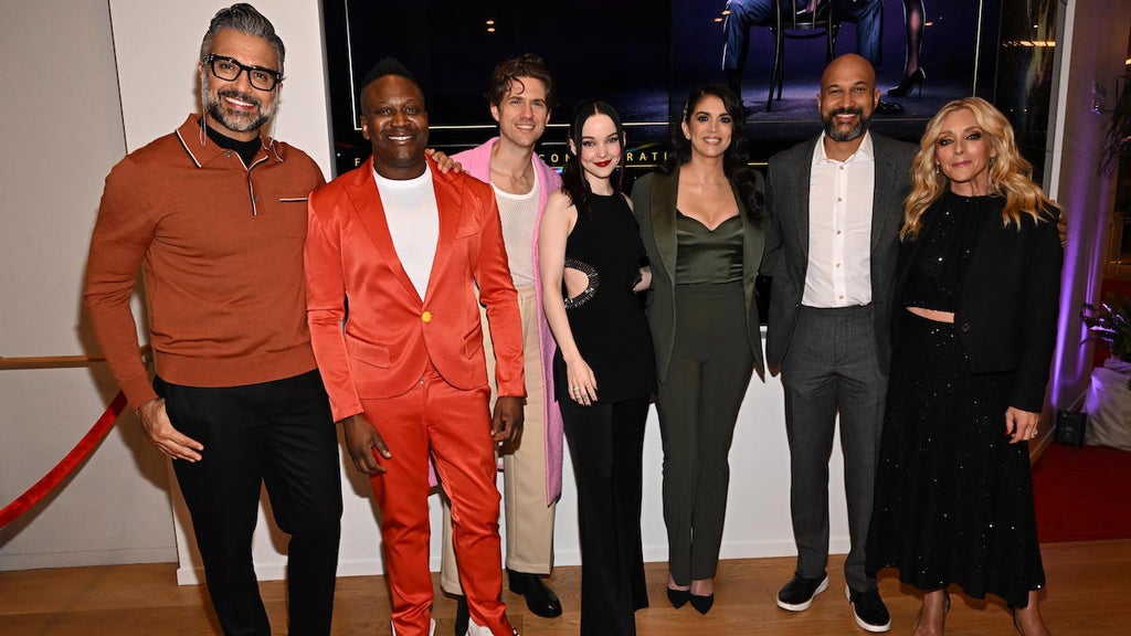 "Schmigadoon!" cast members Jaime Camil, Tituss Burgess, Aaron Tveit, Dove Cameron, Cecily Strong, Keegan-Michael Key and Jane Krakowski (Credit: Eric Charbonneau for Apple TV+)