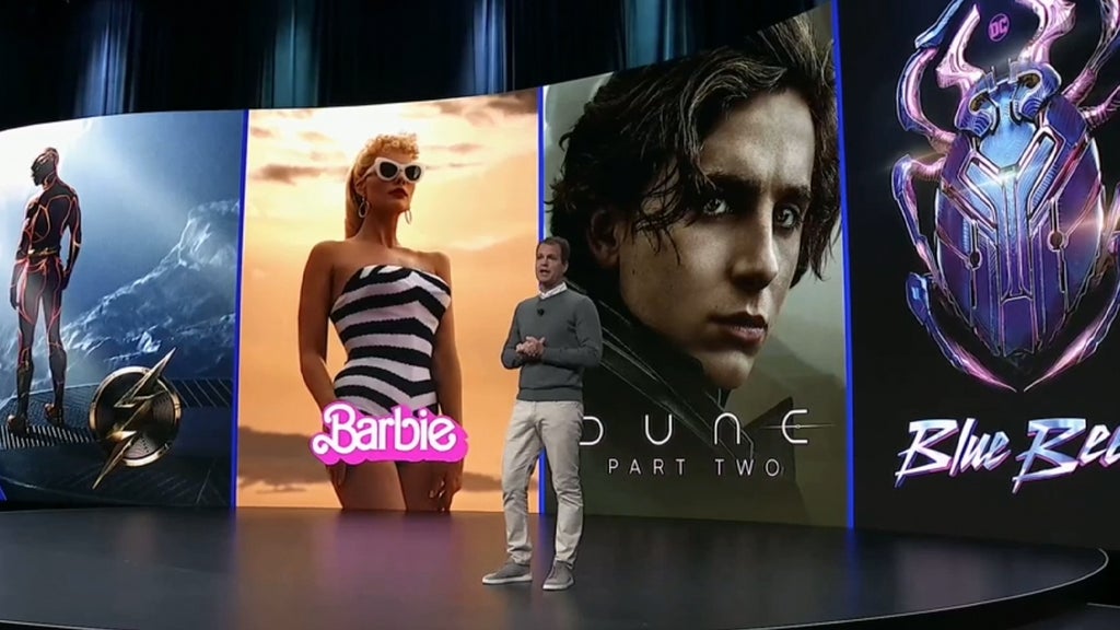 Posters of Warner Bros. Discovery movies like "The Flash," "Dune part II" and "Blue Beetle"
