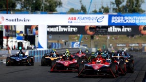 Race cars driving on a track.