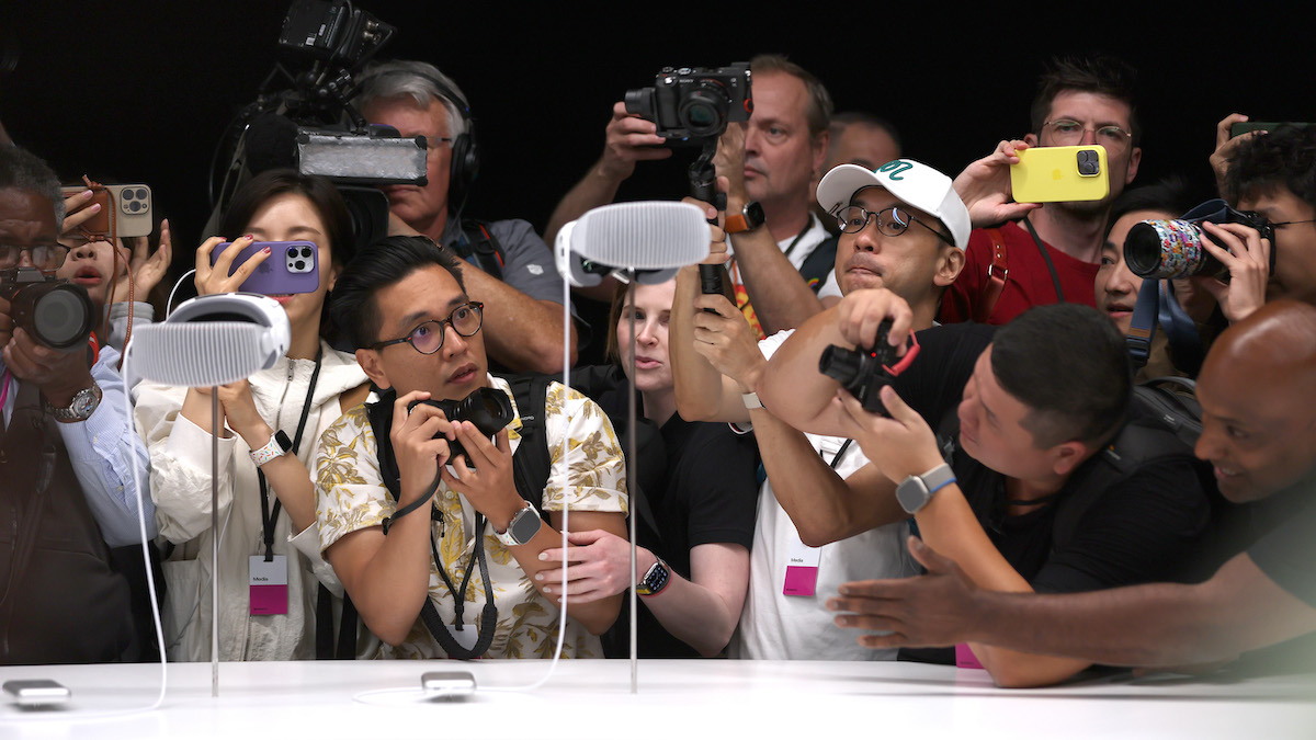 Members of the media inspect the new Apple Vision Pro headset during the Apple Worldwide Developers Conference on June 5, 2023, in Cupertino, Calif. (Photo by Justin Sullivan/Getty Images)