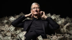 Tim Cook sitting in a pile of money