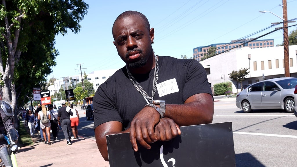 Akeem Mair walks the picket line at Disney Studios on July 20, 2023 in Burbank, California.