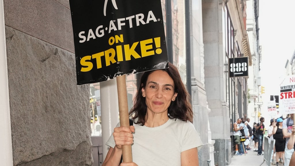 nnie Parisse joins SAG-AFTRA members on the picket line outside of Netflix and Warner Bros on July 20, 2023 in New York City.