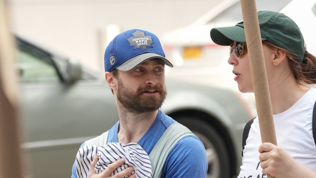 Daniel Radcliffe and Erin Darke join the picket line In New York City on July 21, 2023 in New York City.