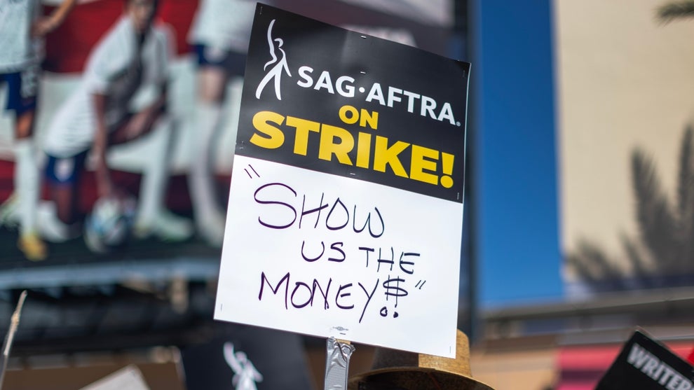 LOS ANGELES, CALIFORNIA - JULY 14: Members of the Hollywood actors SAG-AFTRA union walk a picket line with screen writers outside of FOX Studios on the first day of the actors’ strike which piles on top of the Hollywood writers WGA union strike, now in the 11th week, on July 14, 2023 in Los Angeles, California.