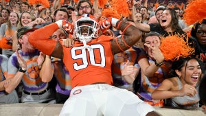 Jabriel Robinson #90 of the Clemson Tigers jumps into the student section (Photo by Grant Halverson/Getty Images)