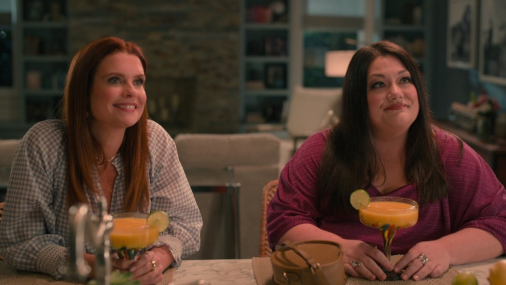 JoAnna Garcia Swisher as Maddie Townsend and Brooke Elliott as Dana Sue, drinking margaritas in a still image from "Sweet Magnolias" (Credit: Netflix)