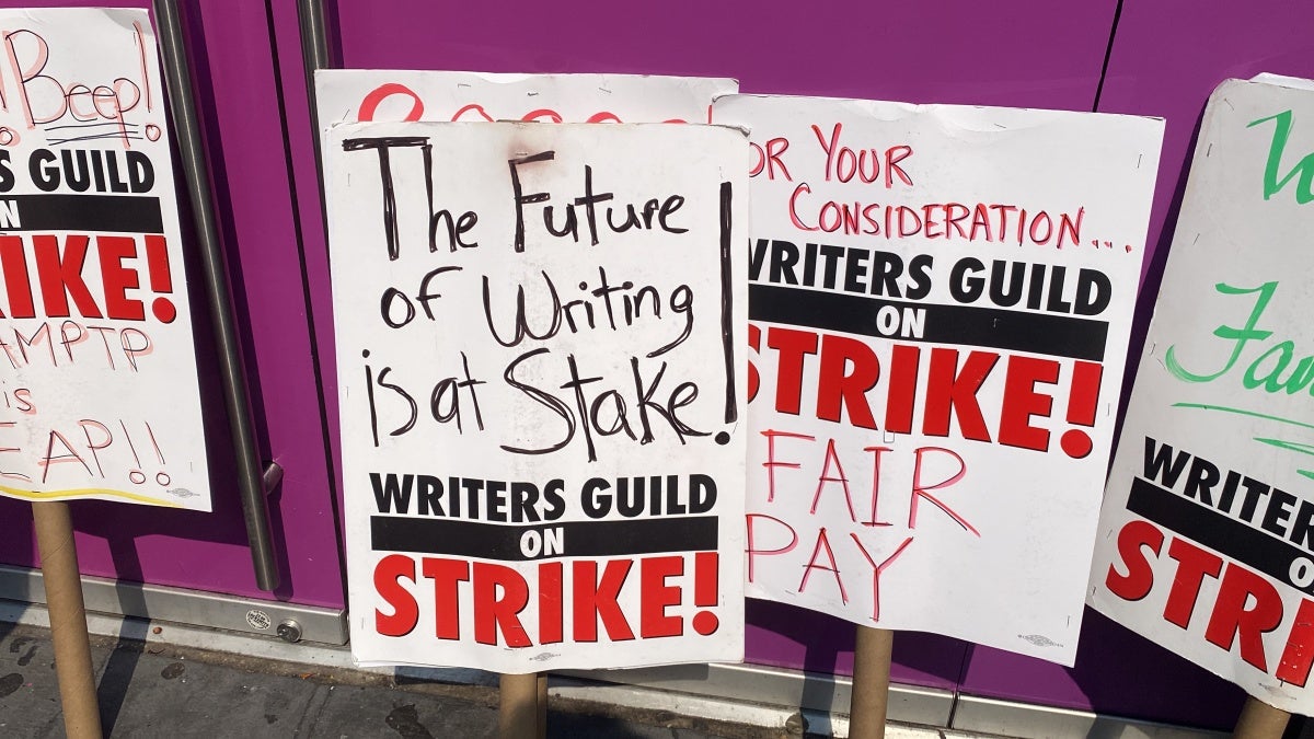 Picket signs at the New York WGA and SAG-AFTRA strike (Photo Credit: TheWrap)