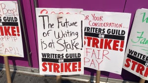 Picket signs at the New York WGA and SAG-AFTRA strike (Photo Credit: TheWrap)