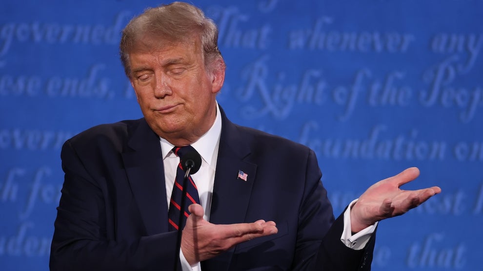 Donald Trump gestures to the side, his eyes closed as he wears a navy suit in front of a blue background with italicized text