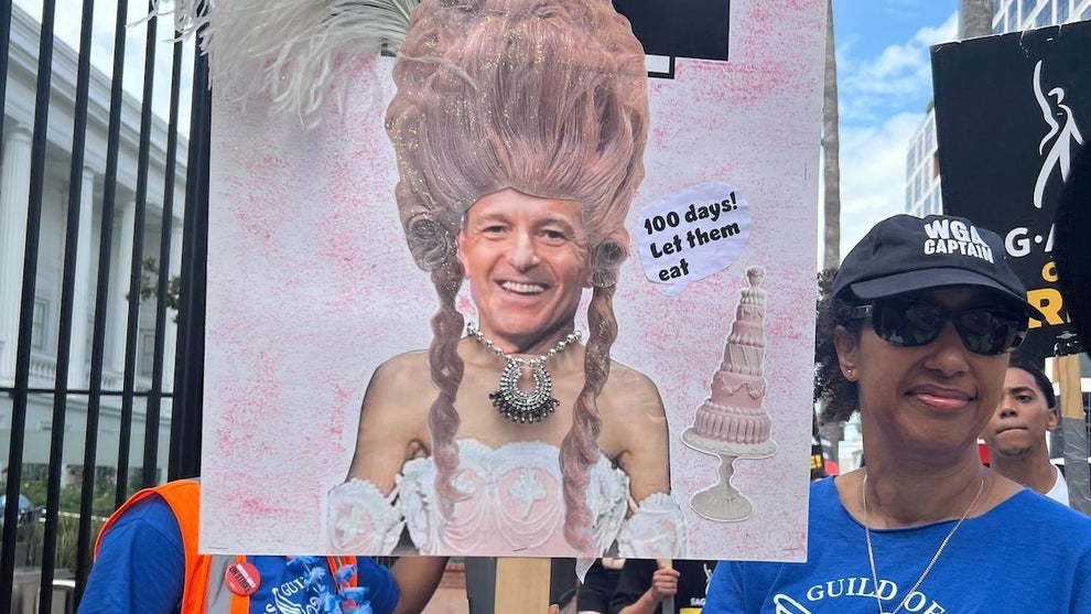 Protester With Sign Mocking Disney CEO Bob Iger, Aug. 9, 2023, Netflix HQ in LA