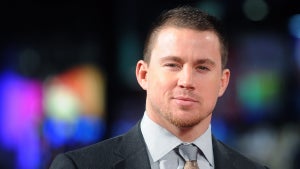Channing Tatum, a man with light skin, gives a slight smile to the camera and wears a suit. roofman