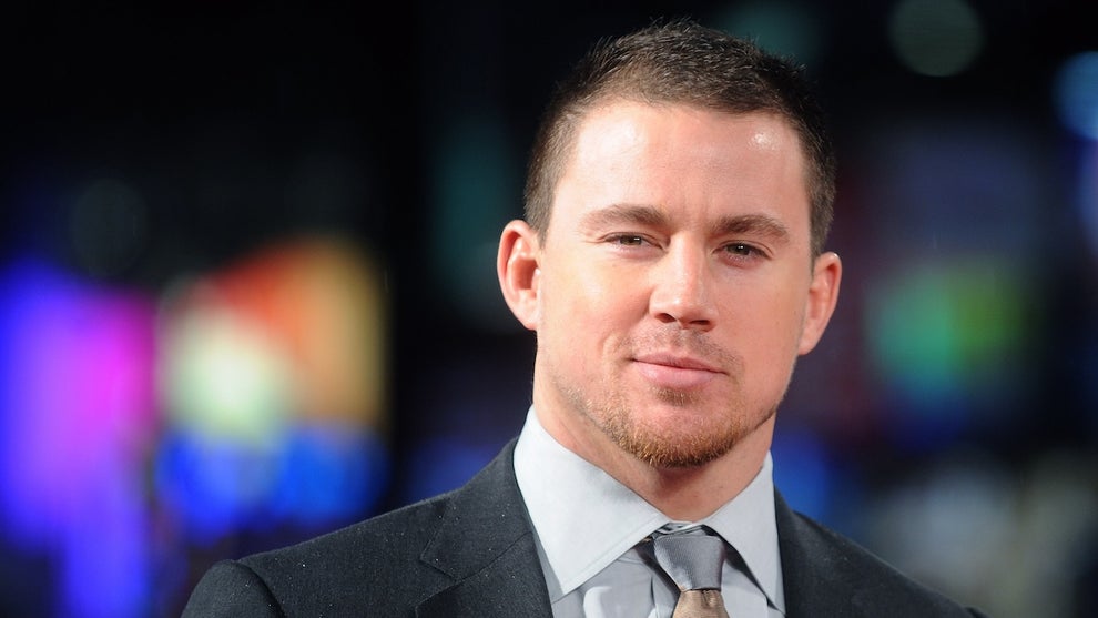 Channing Tatum, a man with light skin, gives a slight smile to the camera and wears a suit. roofman
