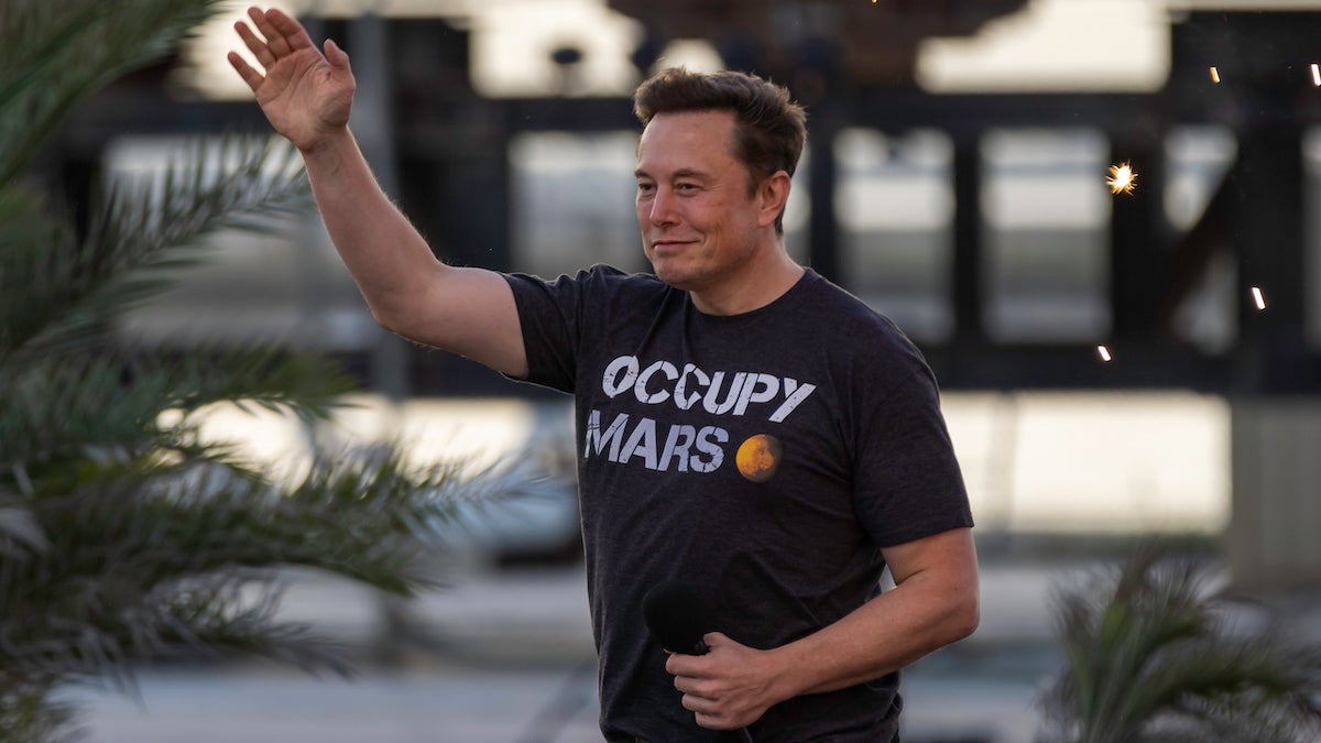 SpaceX founder Elon Musk walks on stage at an August 2022 Starlink event in Boca Chica, Texas.