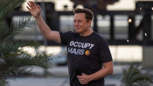 SpaceX founder Elon Musk walks on stage at an August 2022 Starlink event in Boca Chica, Texas.