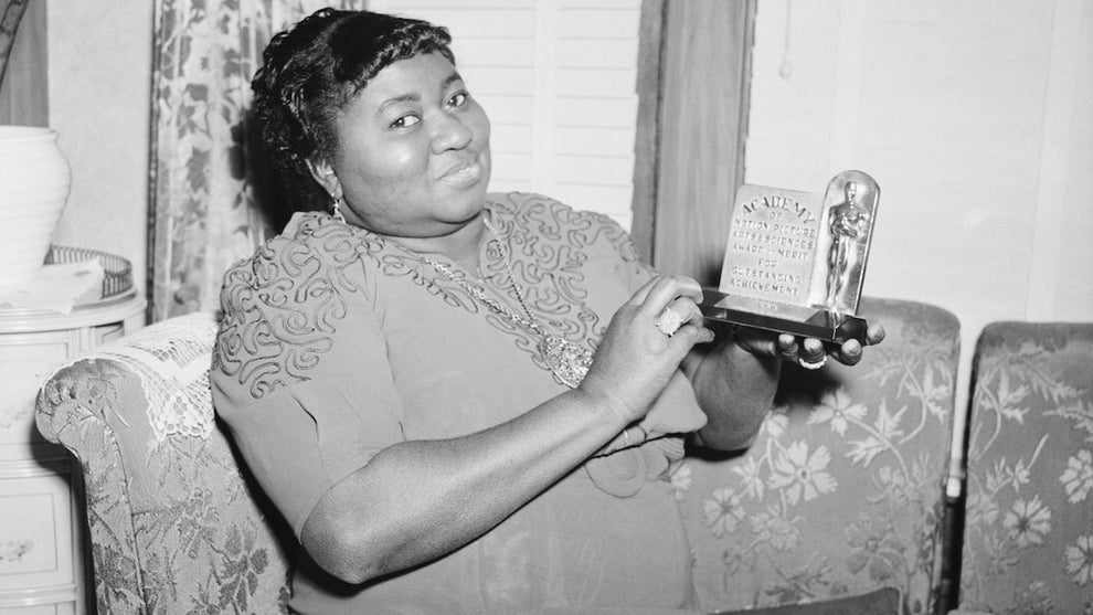 Hattie McDaniel is shown with the statuette she received for her portrayal in "Gone With The Wind." (Credit: The Academy)