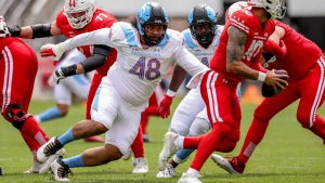 Football players on the field during a game.