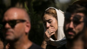 Family and friends of May Naim, 24, who was murdered by Palestinians militants at the "Supernova" festival, near the Israeli border with Gaza strip, react during her funeral on Oct. 11 (Credit: Amir Levy/Getty Images)
